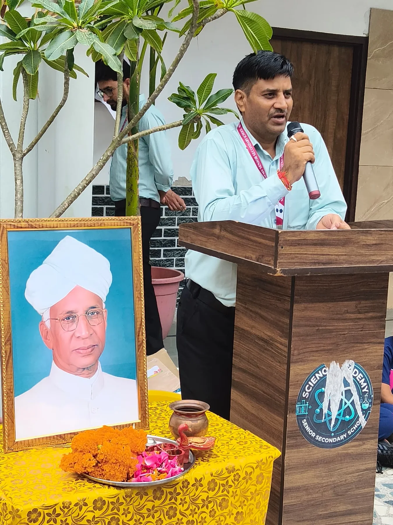 Science Academy teacher addressing the school community