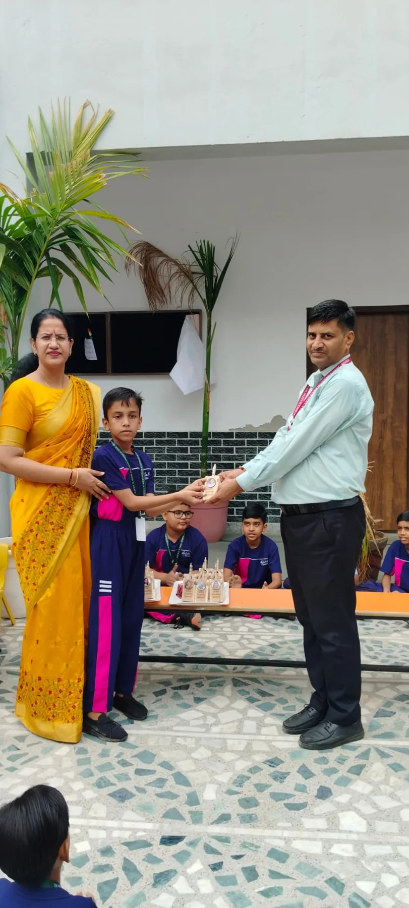 Science Academy teacher and student sharing an award moment